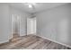 Spacious bedroom featuring wood-look flooring, neutral paint, and ceiling fan for comfortable living at 2917 Crockett Pt, Sanford, FL 32773