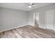 Bright bedroom boasting stylish wood-look floors and comfortable living space at 2917 Crockett Pt, Sanford, FL 32773