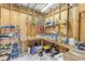 View of the garage area featuring wooden walls and ample storage at 2917 Crockett Pt, Sanford, FL 32773
