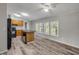Open kitchen with wood cabinets, an island with sink and breakfast bar, and large windows at 2917 Crockett Pt, Sanford, FL 32773