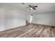 Living room with neutral walls, wood-look floors, and a ceiling fan at 2917 Crockett Pt, Sanford, FL 32773
