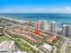 Beautiful coastal community showcasing townhouses with red tile roofs, lush landscaping, and stunning ocean views at 2961 Oceans Trce, Daytona Beach Shores, FL 32118