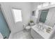 Bathroom with a bright window providing natural light over the commode and shower at 2961 Oceans Trce, Daytona Beach Shores, FL 32118