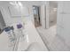 Bright bathroom featuring double sinks, a shower, and plenty of storage space at 2961 Oceans Trce, Daytona Beach Shores, FL 32118