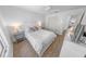 A bright bedroom featuring wood-look floors, a large closet, and comfortable furnishings at 2961 Oceans Trce, Daytona Beach Shores, FL 32118