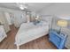 Bright bedroom with wood-look floors, white walls, and a white bed frame that offers a serene coastal ambiance at 2961 Oceans Trce, Daytona Beach Shores, FL 32118