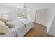 Bright bedroom featuring wood-look flooring, a window, and closet storage at 2961 Oceans Trce, Daytona Beach Shores, FL 32118