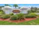 Elegant entryway to Townhomes at the Oceans with manicured landscaping and signage at 2961 Oceans Trce, Daytona Beach Shores, FL 32118