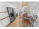 Bright eat-in kitchen with stainless steel appliances, a cozy table, and ample countertop space at 2961 Oceans Trce, Daytona Beach Shores, FL 32118