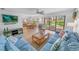 Inviting living room featuring tile floors, comfortable seating, and sliding glass doors at 2961 Oceans Trce, Daytona Beach Shores, FL 32118