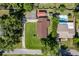 Top-down view of home. Adjacent lot features a pool. Subject property has covered boat parking at 3048 Mango Tree Dr, Edgewater, FL 32141