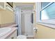 This bathroom offers functionality with a combined shower and toilet, designed for efficiency and practicality at 3048 Mango Tree Dr, Edgewater, FL 32141