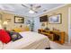 This bedroom features a ceiling fan, ample closet space and a decorative shelf for plants and decorative items at 3048 Mango Tree Dr, Edgewater, FL 32141