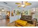 Spacious living room with tile floors, comfortable seating, and open access to the kitchen area at 3048 Mango Tree Dr, Edgewater, FL 32141
