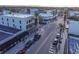 Aerial view of a commercial district with palm trees and street-side parking at 306 Sheldon St, New Smyrna Beach, FL 32168
