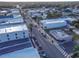 Aerial view of a quaint town featuring tree-lined streets and local commercial buildings at 306 Sheldon St, New Smyrna Beach, FL 32168