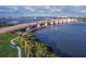 High-angle shot of bridge and waterway under a blue sky, offering stunning vistas with beautiful walkways and foliage at 306 Sheldon St, New Smyrna Beach, FL 32168