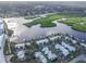 Picturesque aerial shot of waterfront condos with boat slips and surrounding natural landscape at 306 Sheldon St, New Smyrna Beach, FL 32168