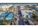 Aerial view of a vibrant beach town showcasing colorful buildings and ocean views in a coastal setting at 306 Sheldon St, New Smyrna Beach, FL 32168