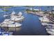 Aerial view of a well-maintained marina with boats docked along the waterfront on a sunny day at 306 Sheldon St, New Smyrna Beach, FL 32168