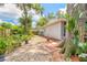 Serene backyard featuring lush landscaping and a charming patio at 3120 Mango Tree Dr, Edgewater, FL 32141