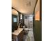 Charming bathroom with modern fixtures, stylish vanity, and a tiled walk-in shower at 3120 Mango Tree Dr, Edgewater, FL 32141