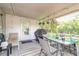 Charming covered patio with outdoor seating perfect for entertaining guests at 3120 Mango Tree Dr, Edgewater, FL 32141