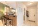 Inviting dining area with a breakfast bar and ample seating, connecting seamlessly to the entryway at 3120 Mango Tree Dr, Edgewater, FL 32141