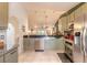 Modern kitchen with stainless steel appliances, tile backsplash, and breakfast bar at 3120 Mango Tree Dr, Edgewater, FL 32141