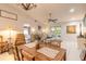 Open-concept living room connected to dining area, filled with natural light from sliding glass doors at 3120 Mango Tree Dr, Edgewater, FL 32141