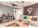 Inviting living room with tile floors, ceiling fans, and comfortable seating for relaxation at 3120 Mango Tree Dr, Edgewater, FL 32141