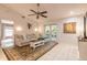 Comfortable living room with cozy seating and views of the screened patio at 3120 Mango Tree Dr, Edgewater, FL 32141
