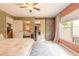 Bright main bedroom featuring a sliding barn door and neutral color palette at 3120 Mango Tree Dr, Edgewater, FL 32141