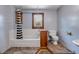 Bathroom featuring a tub shower with black and white curtain, wood vanity and window at 3222 Juniper Dr, Edgewater, FL 32141