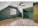 Bedroom features a ceiling fan, a window, carpet flooring, and a closet space at 3222 Juniper Dr, Edgewater, FL 32141