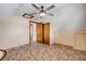 Tan bedroom featuring a ceiling fan, carpet flooring, closet and window at 3222 Juniper Dr, Edgewater, FL 32141