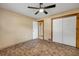 Spacious bedroom includes laminate flooring, ceiling fan, and closet space for an organized and comfortable living area at 3222 Juniper Dr, Edgewater, FL 32141