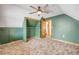 Bedroom features a ceiling fan, closet space, window, and ensuite bathroom at 3222 Juniper Dr, Edgewater, FL 32141