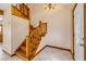 Entryway with wood stairs, white door, and tiled floor with overhead lighting at 3222 Juniper Dr, Edgewater, FL 32141