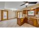This open kitchen has stainless appliances, wood cabinets and an eat-in dining area with views of the backyard pool at 3222 Juniper Dr, Edgewater, FL 32141