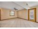 Living area with tile floors, ceiling fan, and a door leading to the outside at 3222 Juniper Dr, Edgewater, FL 32141