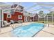 A kidney shaped pool is adjacent to the house with an awning-covered door and patio seating nearby at 3222 Juniper Dr, Edgewater, FL 32141