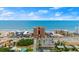 Another aerial view of the beachfront condo building and the beach with blue skies at 3245 S Atlantic Ave # 208, Daytona Beach, FL 32118