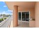 Wide balcony featuring a grill and a beautiful view of the street at 3245 S Atlantic Ave # 208, Daytona Beach, FL 32118