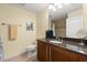 Bathroom featuring granite countertops, neutral paint, tile flooring, and shower at 3245 S Atlantic Ave # 208, Daytona Beach, FL 32118
