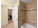 Bathroom featuring tile flooring, a shower, and neutral paint at 3245 S Atlantic Ave # 208, Daytona Beach, FL 32118
