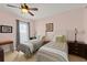 Bedroom featuring twin beds, tile flooring, and ceiling fan at 3245 S Atlantic Ave # 208, Daytona Beach, FL 32118