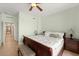 Bedroom featuring a comfortable bed, ceiling fan, and tasteful decor at 3245 S Atlantic Ave # 208, Daytona Beach, FL 32118