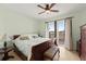 Bright bedroom with a ceiling fan and balcony access at 3245 S Atlantic Ave # 208, Daytona Beach, FL 32118
