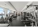 Bright gym features cardio equipment, weight machines, black rubber floor, and ocean view at 3245 S Atlantic Ave # 208, Daytona Beach, FL 32118